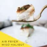 Easy air fryer miso glazed halibut with sake butter sauce on white plate with baby bok cho