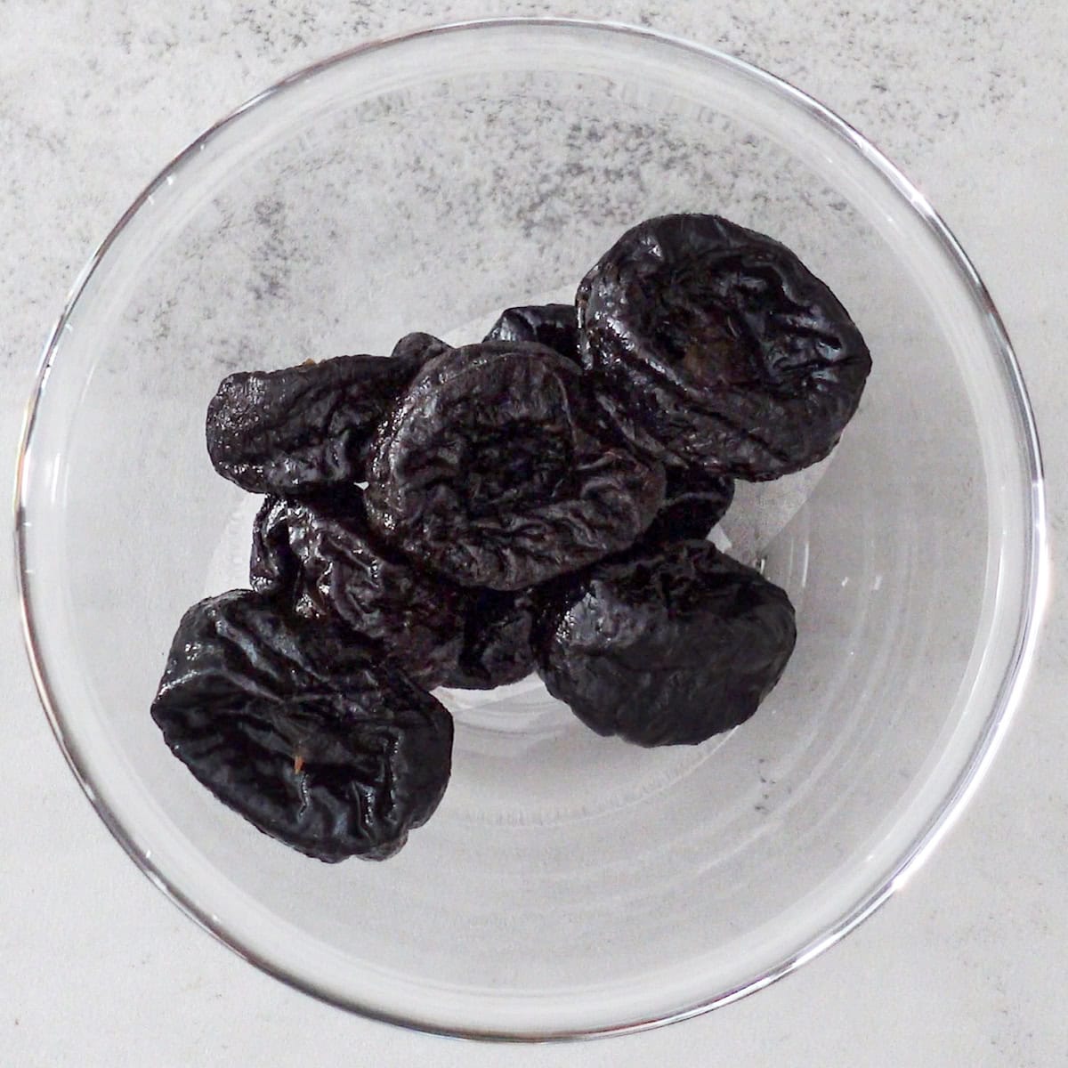 close up of california prunes dried whole pitted
