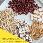 San Fu Period soup ingredients - adzuki beans, Job's tears, Poria mushroom and Mai Dong arranged on wooden table