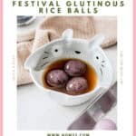 Black sesame tang yuan glutinous rice balls in ceramic bowls with warm ginger broth for Mid-Autumn Festival