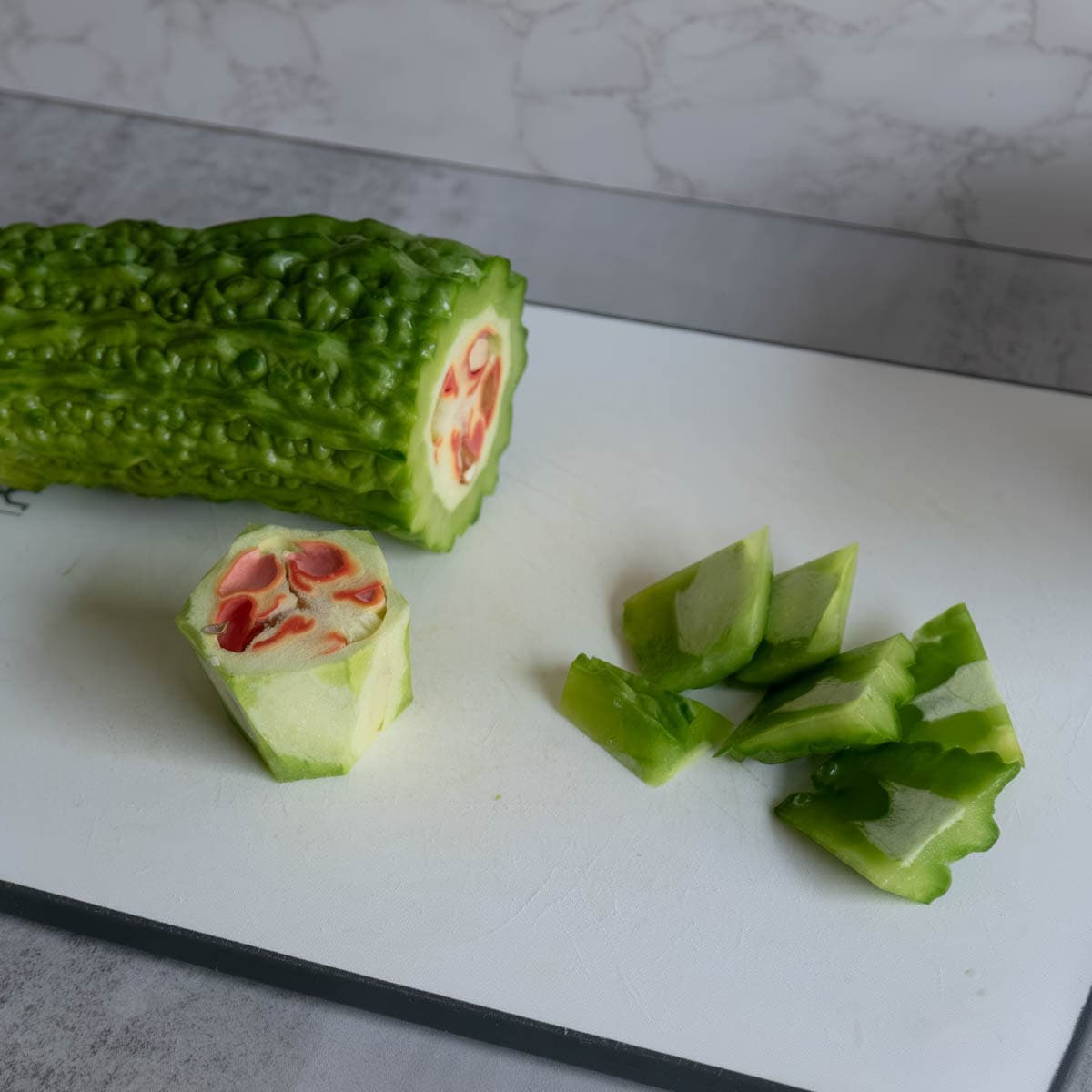 Discover this authentic bitter melon soup recipe with pork ribs and pickled greens. Traditional Chinese medicine cooling soup perfect for summer heat. Ready in 3 hours!