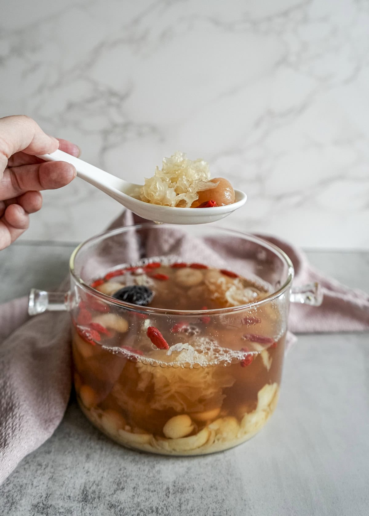 Autumn dryness relief TCM lotus seed lily snow fungus dessert in ceramic bowl for seasonal wellness