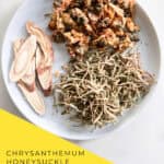 Chrysanthemum honeysuckle tea recipe ingredients arranged with measuring spoons and Chinese tea set