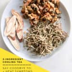 Chrysanthemum honeysuckle tea recipe ingredients arranged with measuring spoons and Chinese tea set