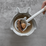 Bowl of traditional Cantonese kidney nourishing soup with chopsticks ready to serve for adrenal fatigue recovery