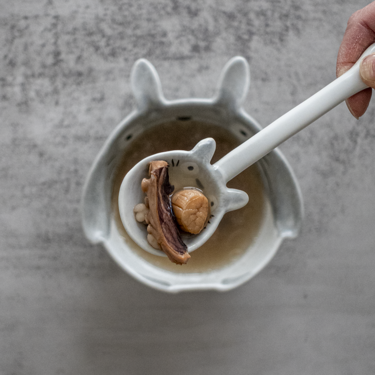 Bowl of traditional Cantonese kidney nourishing soup with chopsticks ready to serve for adrenal fatigue recovery