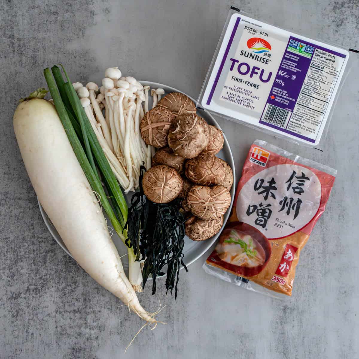 Kombu seaweed strip daikon radish and silken tofu ingredients for Japanese miso soup