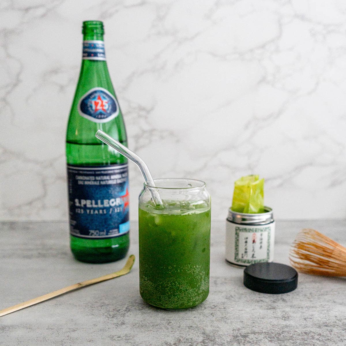 Sparkling matcha recipe with San Pellegrino in glass showing green gradient and bubbles