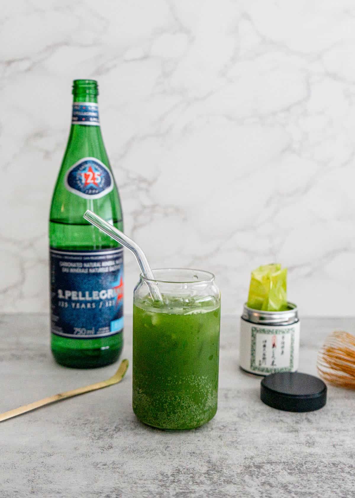 Sparkling matcha recipe with San Pellegrino in glass showing green gradient and bubbles