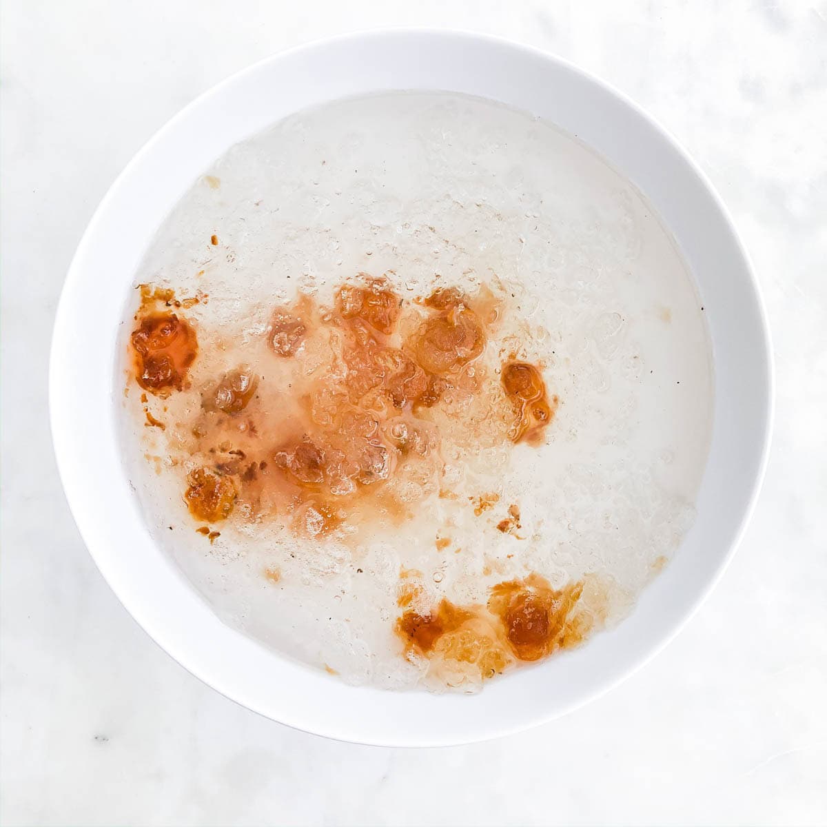 Soaked peach gum AND SNOW NEST SWALLOW expanded to translucent jelly-like pieces in bowl