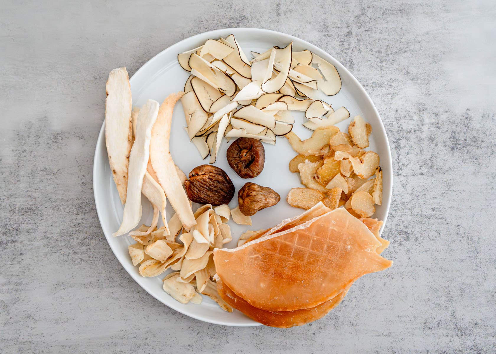 Dried sea coconut, Chinese yam slices, conch meat, and honey dates for TCM menstrual soup recipe