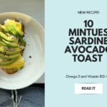 Close up of sardine avocado toast garnished with cilantro and lemon juice