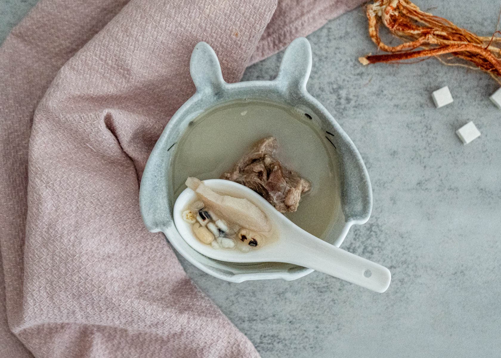 Classic TCM spring dampness soup 健脾去濕湯 with hairy fig five-finger peach pork bones and lotus seeds in ceramic pot