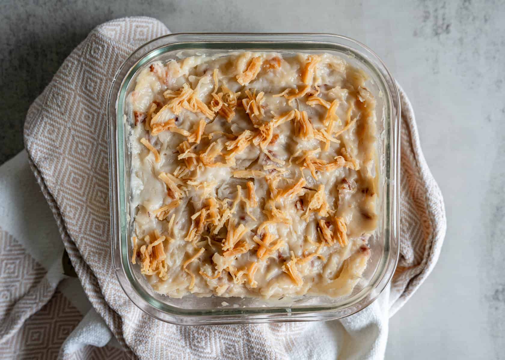 Whole steamed lo bak go Chinese turnip cake fresh from steamer with dried scallops on top