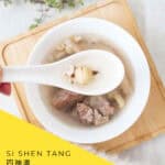 Overhead photo of Si Shen Tang with pork in a ceramic bowl, with a white spoon resting above the broth. A diagonal yellow panel reads “Si Shen Tang 四神湯 Chinese Herbal Soup.”